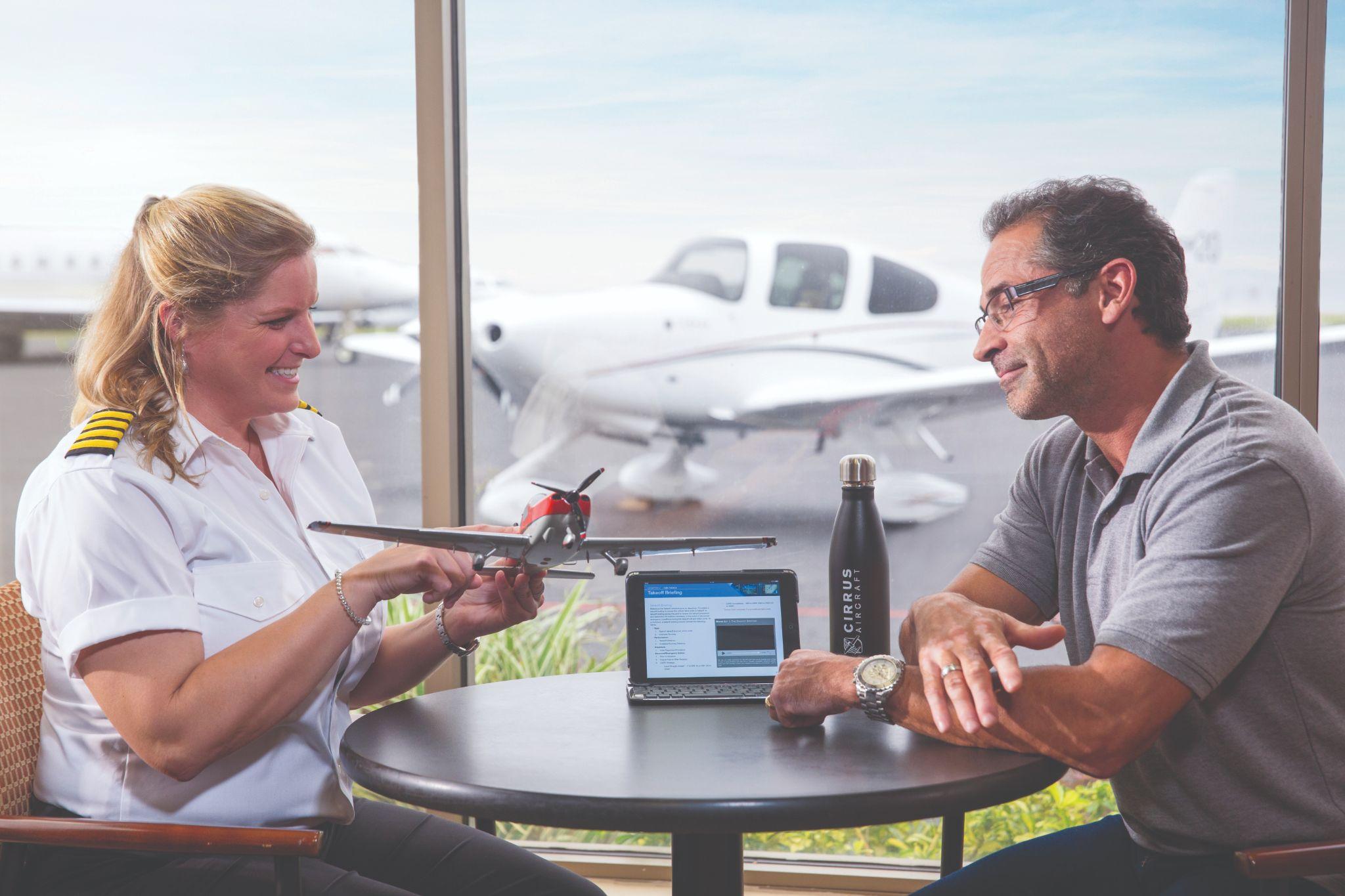 Aviation briefing scene with aircraft visible outside